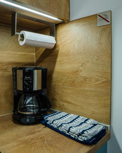 a coffee maker sitting on a counter with a paper towel at RITUAL Apartment - 20m from the sea in Lovran