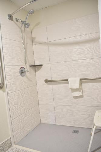 a shower with a glass door in a bathroom at Clarion Pointe Vidalia - Lyons West in Vidalia
