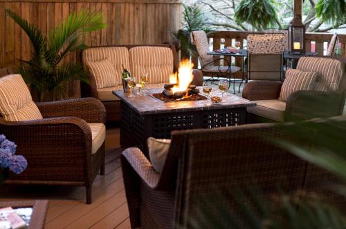a living room with a fire pit in the middle at 1825 Inn Bed and Breakfast in Palmyra
