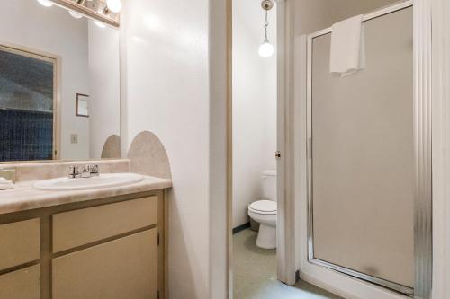 a bathroom with a sink and a toilet at Northern Queen Inn in Nevada City