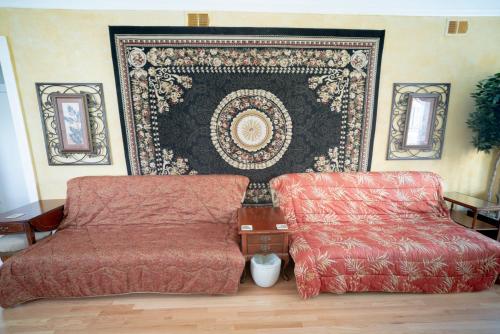 a living room with a chair and a rug at City Villa Sleeps 10-20 Free TV & Parking in Chicago
