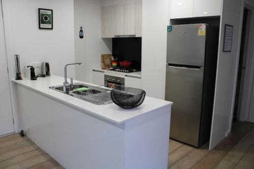 Η κουζίνα ή μικρή κουζίνα στο Cosy 2B apartment with private parking