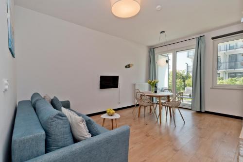 TV a/nebo společenská místnost v ubytování BlueApart Apartamenty Hotelowe Nexo