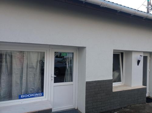 a door of a building with a doorkying sign on it at Apartment parking loft Akaciju in Vilnius