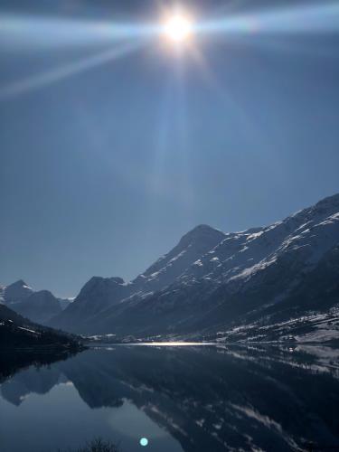 a view of a body of water with mountains at Solvik #apartment #Loen in Loen