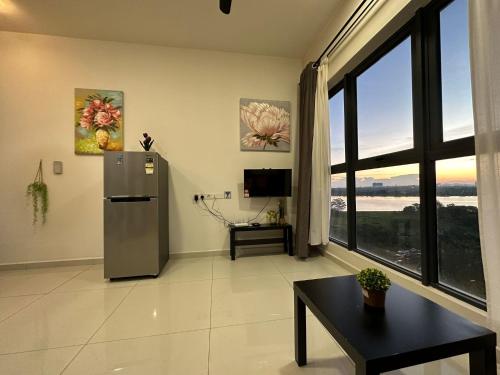 a living room with a refrigerator and a window at Flowers @ Country Garden Danga Bay in Johor Bahru