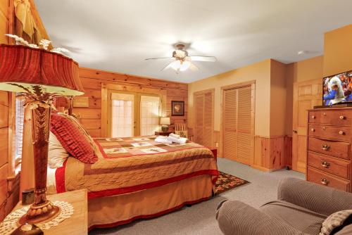 a bedroom with a bed and a tv in it at Eagles View in Boone