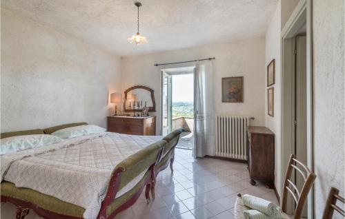 a bedroom with a bed and a desk and a window at Soratte in Poggio Catino