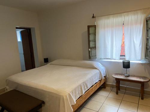 a bedroom with a bed and a window with the eiffel tower at Mesón Don Quijote in Ajijic