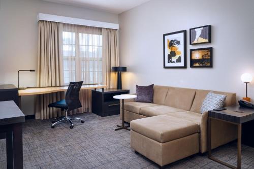 a living room with a couch and a desk at Residence Inn Fort Lauderdale SW/Miramar in Miramar