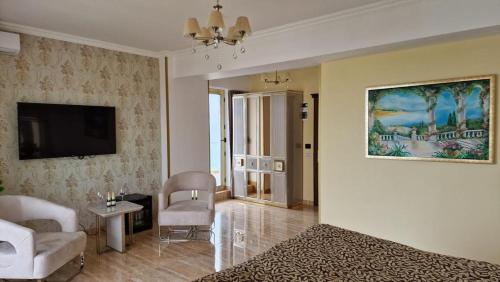 TV a/nebo společenská místnost v ubytování Alessio Hotel Residence