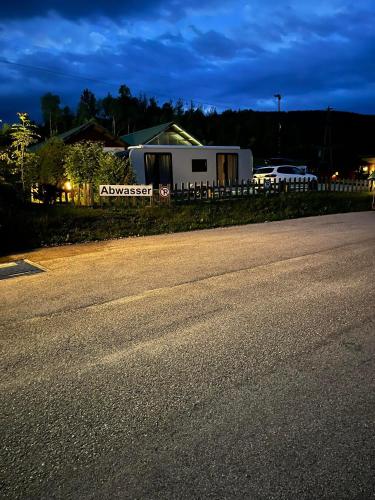 an empty road in front of a house at ROSSLWIRT-Rast in Strass im Attergau