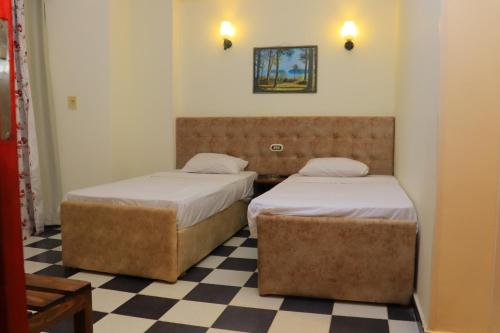 Ένα ή περισσότερα κρεβάτια σε δωμάτιο στο Royal City Hotel