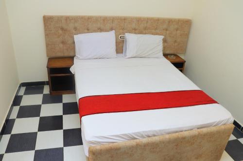 Ένα ή περισσότερα κρεβάτια σε δωμάτιο στο Royal City Hotel