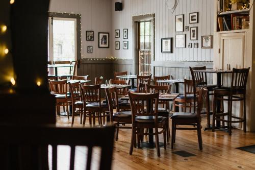 a group of tables and chairs in a restaurant at Volcano Union Inn and Pub in Volcano