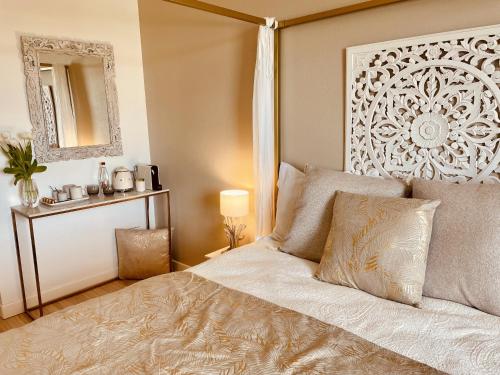 a bedroom with a large bed and a mirror at Lalagunebages, Panoramic View in Bages