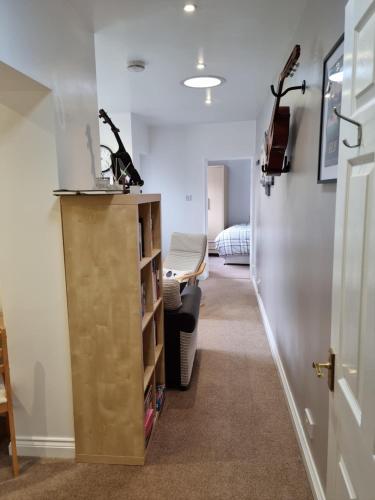a hallway with a hospital room with a bed at Beautiful studio in Ely in Ely