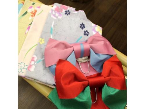 a cake with a bow on top of a table at Ikaho Onsen Sanyo Hotel - Vacation STAY 26406v in Shibukawa