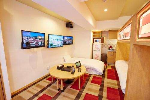 a small room with a bed and a table at Hotel Sanriiott Kitahama - Vacation STAY 33472v in Osaka