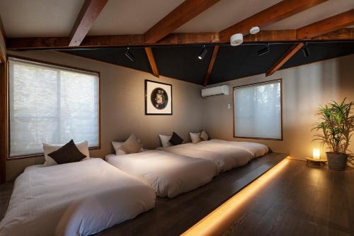 Säng eller sängar i ett rum på Goshikihama Villa - Vacation STAY 36099v