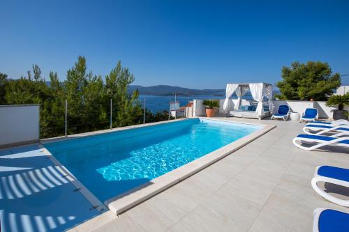 a swimming pool in a villa with a view at Villa Mare in Klek