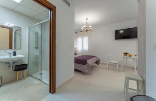 Televízia a/alebo spoločenská miestnosť v ubytovaní Villa Augusto Cosy Romance
