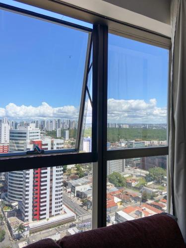 a view of a city from a window at VISTA MAR BOA VIAGEM - BEACH CLASS EXECUTIVE in Recife