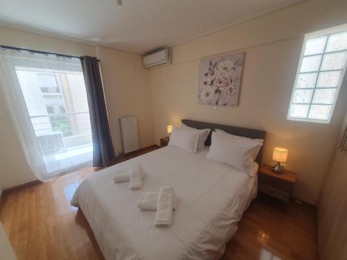 Ένα ή περισσότερα κρεβάτια σε δωμάτιο στο Lux & Style 75sqm with Private Parking in Athens