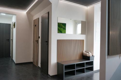 a hallway with a bench in a house at Penzion Smile in Brno