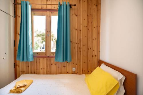 Postel nebo postele na pokoji v ubytování Milos Alexandra Studio