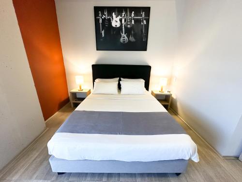 Ein Bett oder Betten in einem Zimmer der Unterkunft Hotel Arena Suites Movistar Arena