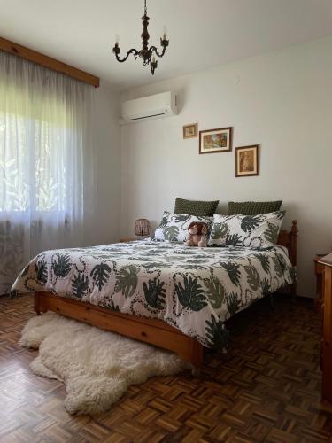 a bedroom with a bed with a dog laying on it at B&B Da Leone in Palazzolo dello Stella