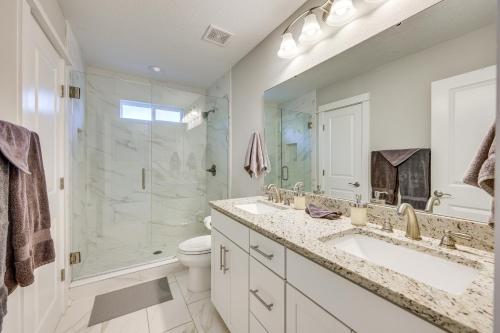 a bathroom with a sink and a shower and a toilet at Pet-Friendly Townhome, 1 Mi to Southbank Riverwalk in Jacksonville