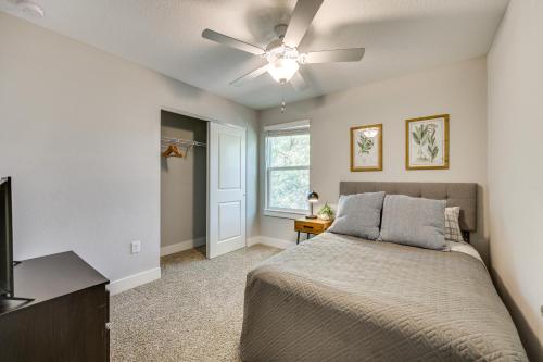 a bedroom with a bed and a ceiling fan at Pet-Friendly Townhome, 1 Mi to Southbank Riverwalk in Jacksonville