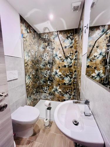 a bathroom with a toilet and a sink at A Pisa con amore in Pisa