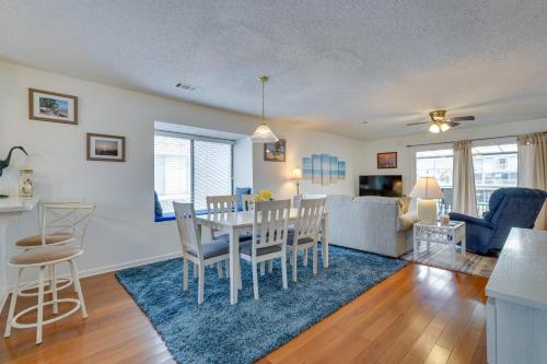 a dining room and living room with a table and chairs at Cape San Blas Townhome with Beach Essentials! in Oak Grove