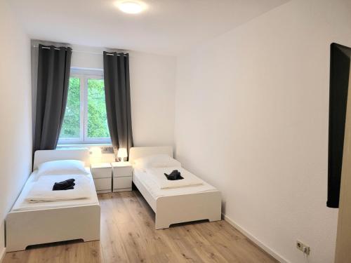 Postel nebo postele na pokoji v ubytování Voll ausgestattete Ferienwohnung in Dresden