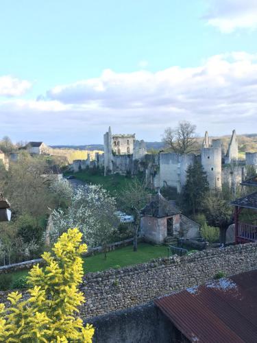 a castle in the middle of a town at Chez Fred avec vue sur le Château in Angles-sur-lʼAnglin