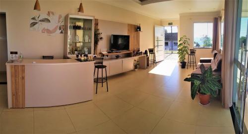 a large room with a kitchen and a living room at Pousada São Gabriel in Ametista do Sul