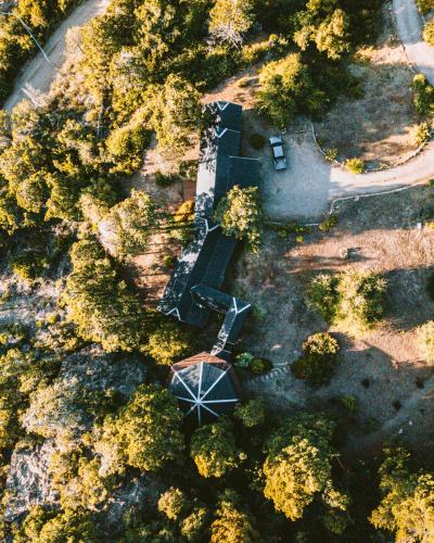 an overhead view of a park with a bench and trees at Arrayan Lake View Mountain Lodge & Casa De Te Arrayan in San Martín de los Andes
