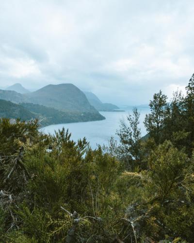 a view of a lake with mountains in the background at Arrayan Lake View Mountain Lodge & Casa De Te Arrayan in San Martín de los Andes