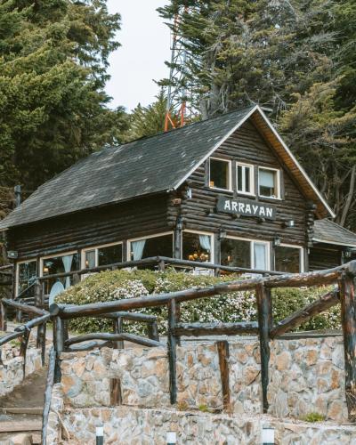 a log cabin building with a sign on it at Arrayan Lake View Mountain Lodge & Casa De Te Arrayan in San Martín de los Andes