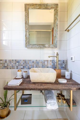 a bathroom with a sink and a mirror at Eliva house in Chania