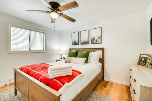 a bedroom with a bed and a ceiling fan at Deck and Community Perks Bright Pocono Lake Home! in Pocono Lake