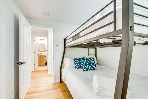 a bedroom with a bunk bed and a ladder at Deck and Community Perks Bright Pocono Lake Home! in Pocono Lake