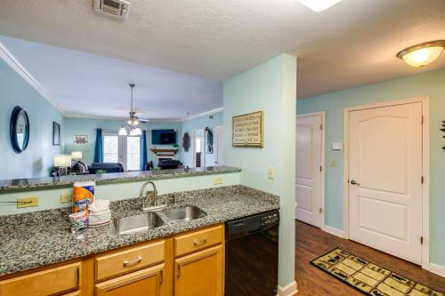 a kitchen with a sink and a counter top at Pigeon Forge Condo with Community Amenities! in Pigeon Forge