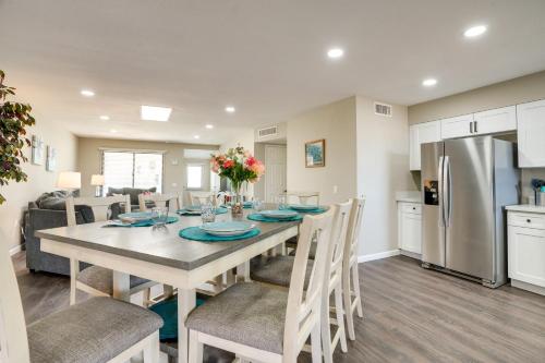 a kitchen and dining room with a table and chairs at Golfers Oasis! 55 and Sun City West Retreat with Pool in Sun City West