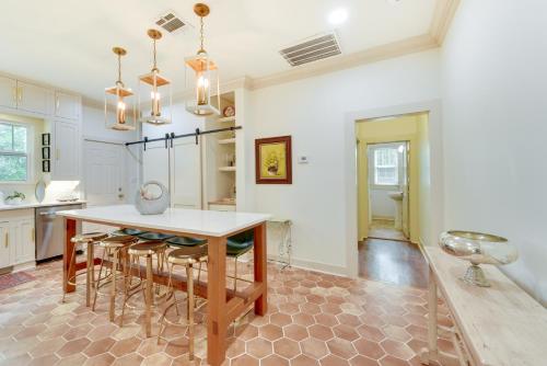 a kitchen with a table and chairs in a room at Charming Lake Charles Vacation Rental with Yard in Lake Charles