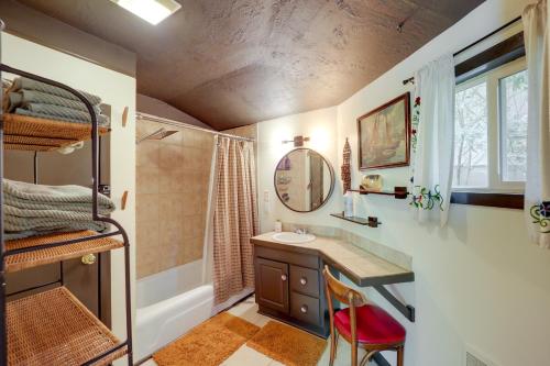 a bathroom with a sink and a bunk bed at Quaint Vacation Rental with Porch in Banner Elk! in Banner Elk