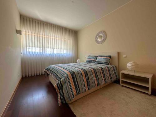 Кровать или кровати в номере Canidelo Modern Apartment